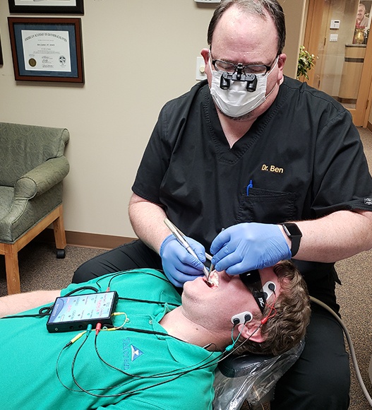 Dentist treating dental patient in state of the art dental office
