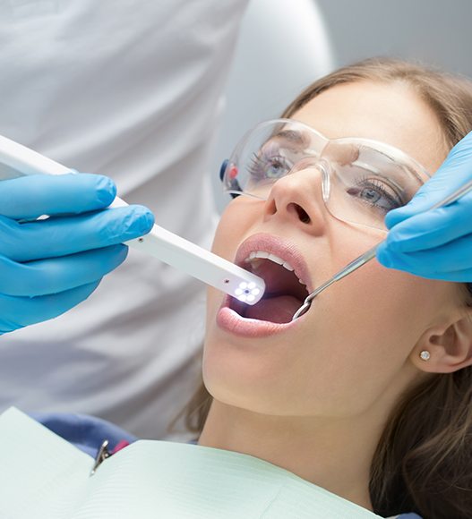 Dentist using intraoral camera to capture smile photos