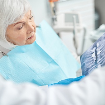 Woman talking to dentist during dental implant consultation