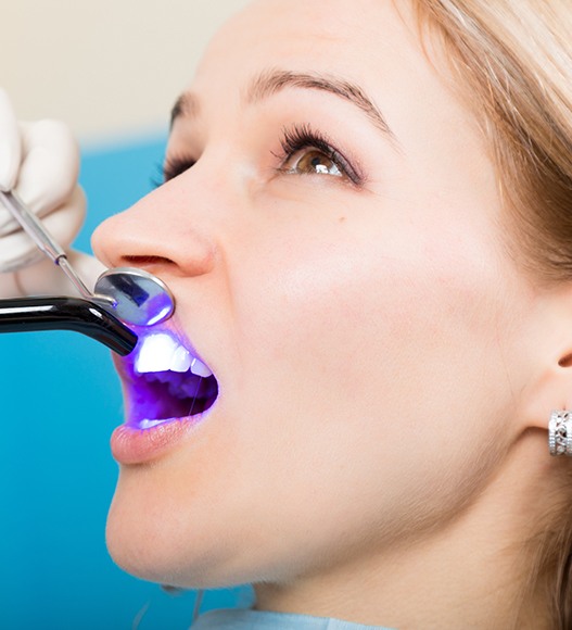 Woman receiving cosmetic dental bonding treatment