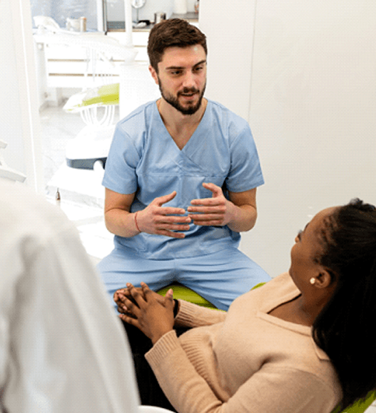 woman talking to cosmetic dentist