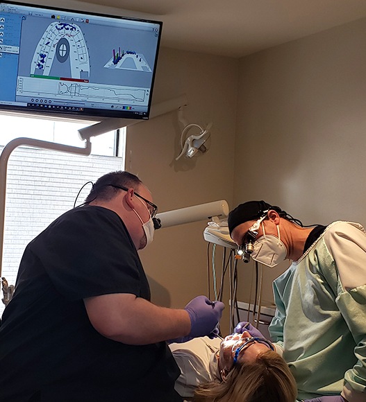 Dentist treating dental patient