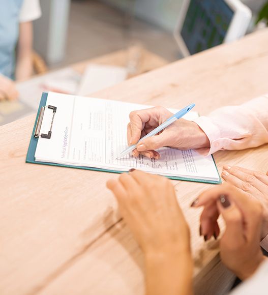 Patient completing dental insurance forms