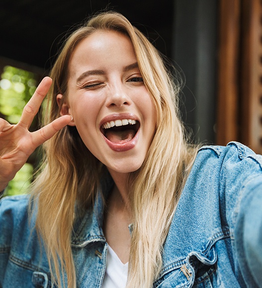 Woman with beautiful smile after cosmetic dentistry