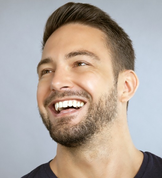 Man with bright smile after teeth whitening