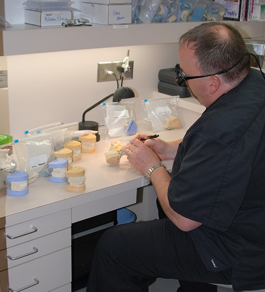 Dentist creating dental crowns and bridges