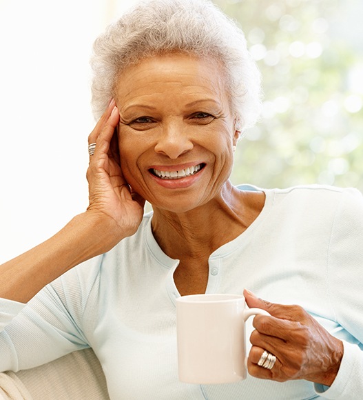 Woman smiling after T M J therapy