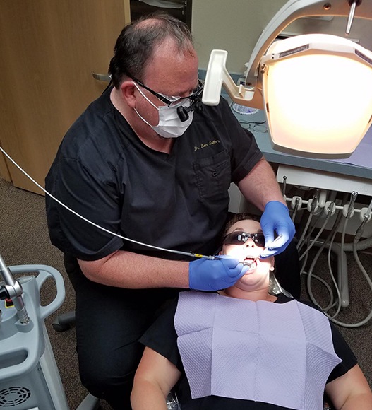 Dentist providing preventive dentistry checkup and teeth cleaning