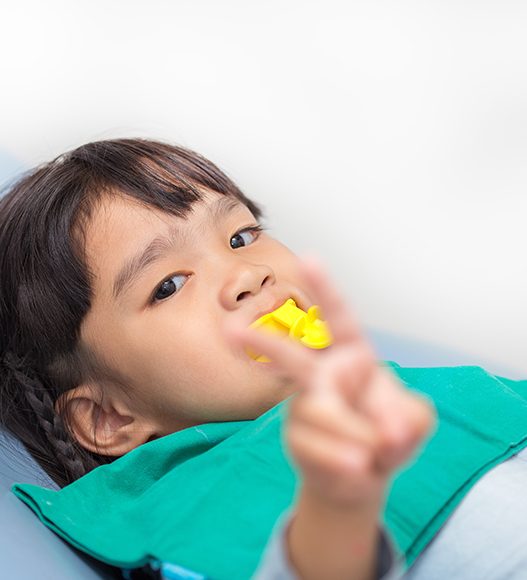 Child receiving fluoride treatment