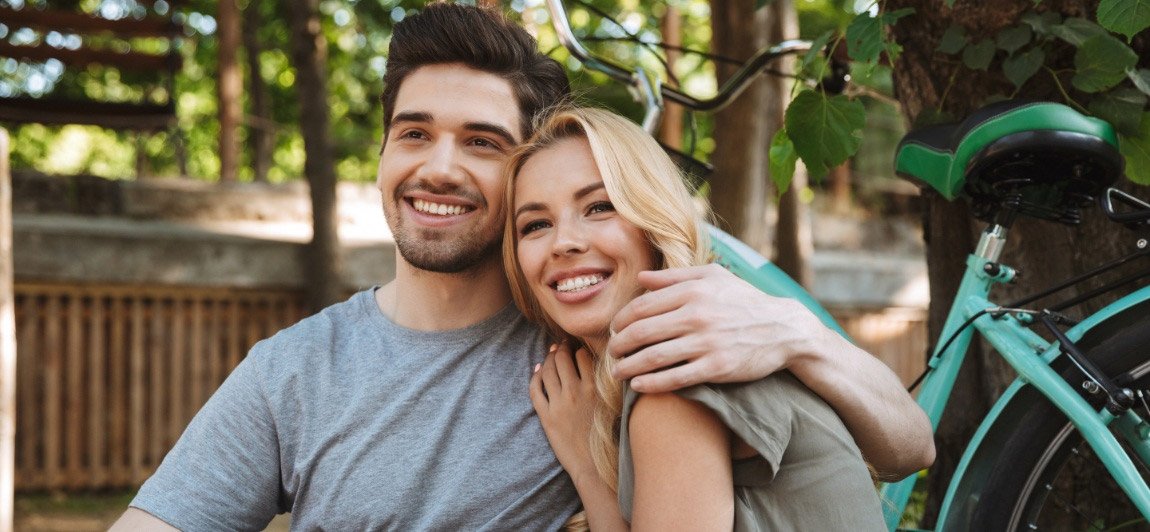 Man and woman with attractive smiles after cosmetic dentistry
