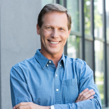 Man with healthy smile after T M J therapy