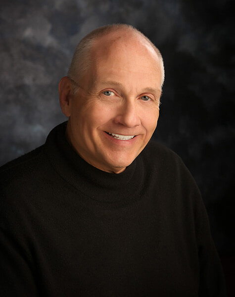 Older man sharing smile after comprehensive dentistry