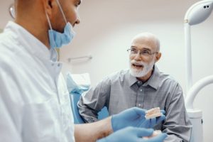 An older patient receiving a same-day denture in Eugene.