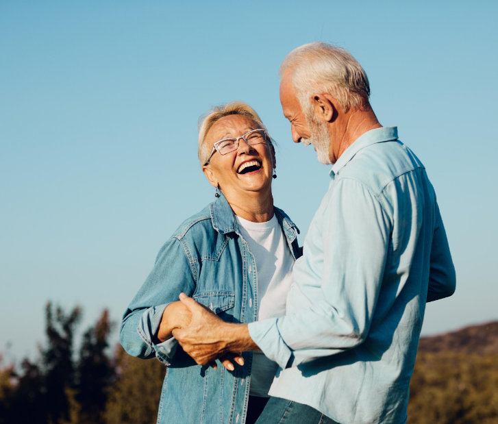 Senior couple smiling and dancing