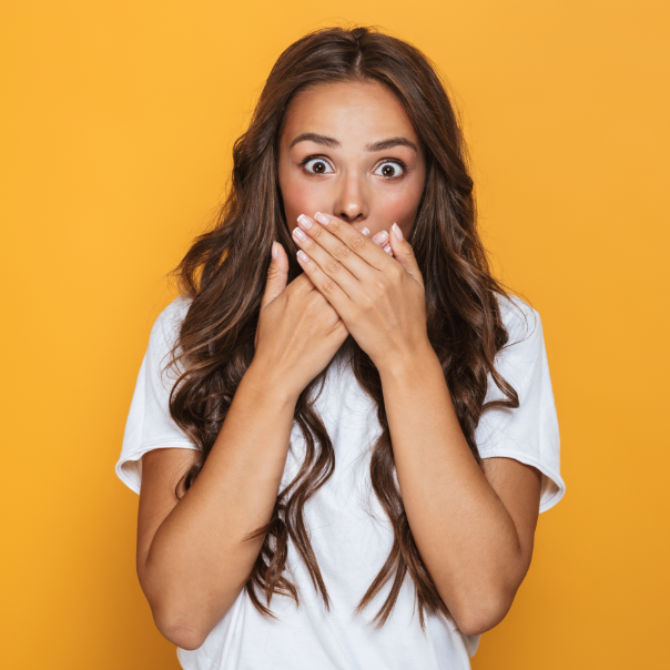 Woman covering mouth